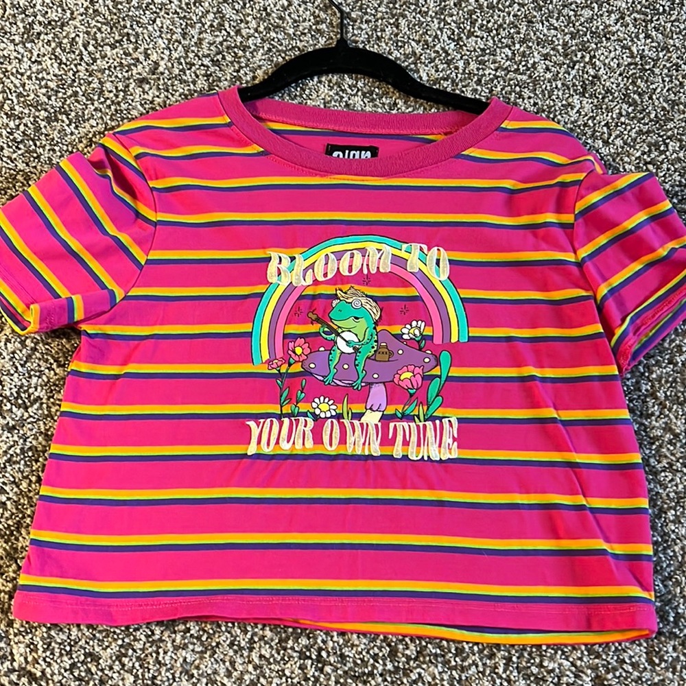Size Small baby T. “Bloom to your own tune”.